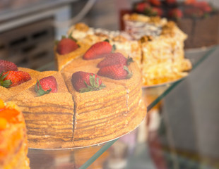 Delicious gourmet cakes in a bakery window