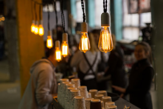 Selective focus view on light bulbs in cafe