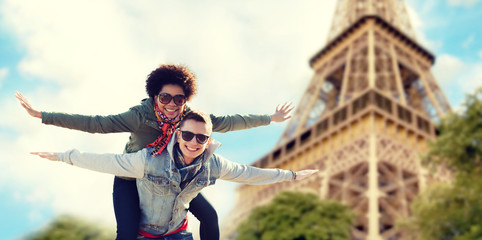 happy teenage couple over paris eiffel tower