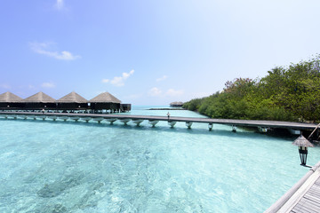 Over water bungalows with steps into amazing green lagoon