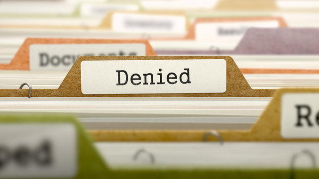 Denied on Business Folder in Multicolor Card Index. Closeup View. Blurred Image. 3D Render.