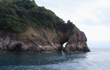 rock cave island with blue sea landscape view