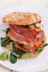 Bacon sandwich with tomato and pickles