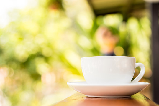 coffee cup on wooden table ,soft focus
