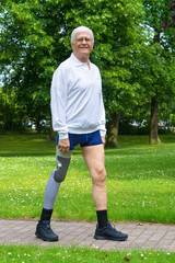 Smiling senior man with false leg.