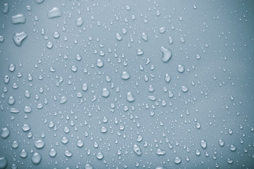 Dops of water on a color background. Blue. Toned