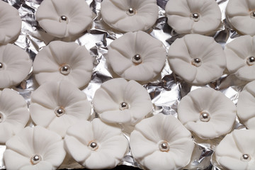 Many sugar mastic flowers for background