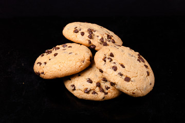 American cookies with chocolate drops on a black background