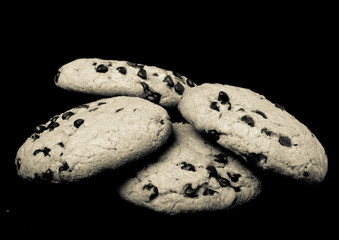 American cookies with chocolate drops on a black background. Ton