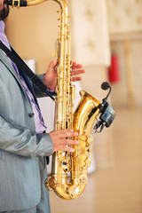 the saxophonist plays a saxophone