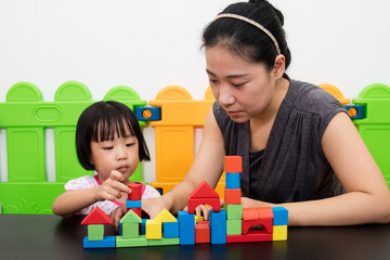 Asian Little Chinese Girl and Mother Playing Together