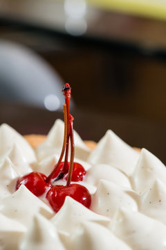 maraschino cherry in tart with cream