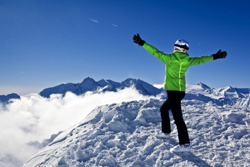 young woman is enjoying winter sports in Austrian Alps