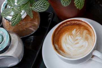 Close-up cup of latte coffee on wooden (Selective focus)