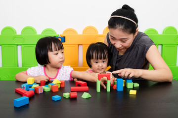 Asian Kids and Mother Playing Together