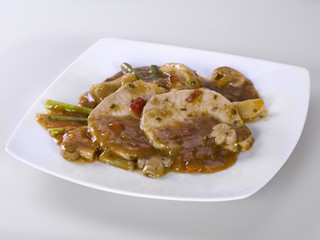 Meat sauce with beans, peppers and asparagus on white background