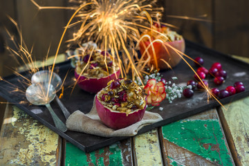 Festive baked red apples stuffed with granola, cranberries and marzipan