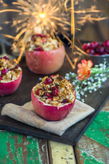 Festive baked red apples stuffed with granola, cranberries and marzipan