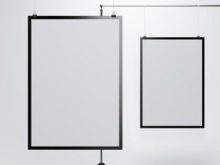 Two white posters hanging 