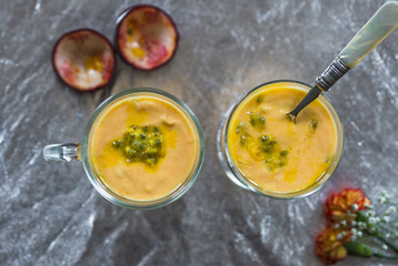 Yogurt dessert with mango and passion fruit - top view