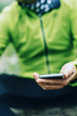 young sportsman using his smartphone