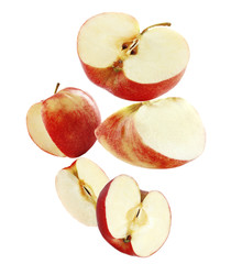 Falling ripe apples isolated on white