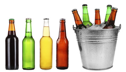 Different types of beer in bottles, isolated on white © Africa Studio