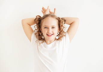 Funny little girl showing a bunny
