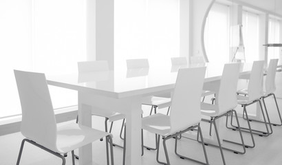 White chairs and glass table.