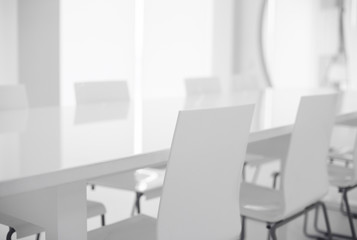 White chairs and glass table.