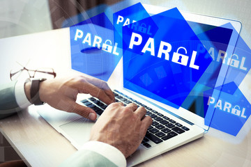 Man working on laptop with icons security on virtual display. Technology, internet and networking concept.