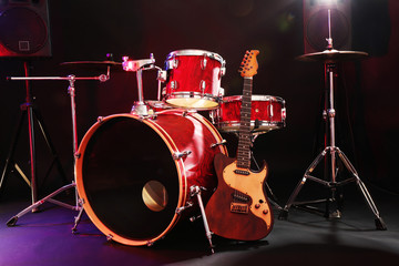Naklejka na ściany i meble Musical instruments on a stage on dark background