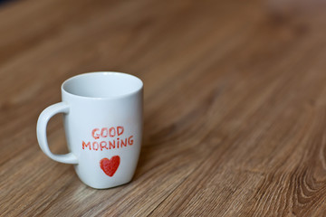 good morning.White cup on the table