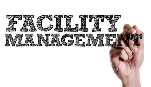 Hand writing the text: Facility Management