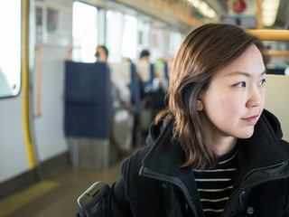 Asian woman in train