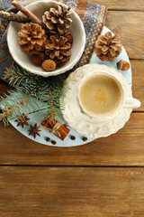 Cup of coffee and Christmas tree branch on napkin