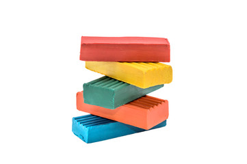 Pile of colorful children's plasticine isolate on white