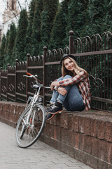 Fototapeta na wymiar beautiful hipster girl with bicycle