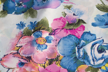 the texture of a fabric with a floral pattern background