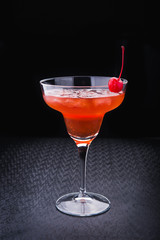 alcoholic cocktail with cherry