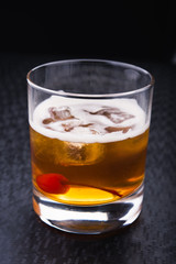 alcoholic cocktail with cherry