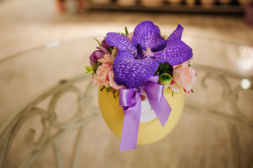 Small bouquet of flowers  with purple orchid