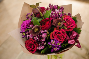 Beautiful bouquet red violet purple flowers, roses,