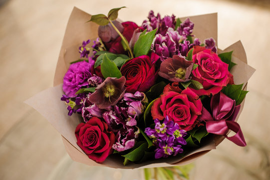 Fototapeta Beautiful bouquet red violet purple flowers, roses,
