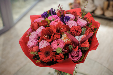 Beautiful bouquet red violet purple flowers, roses,