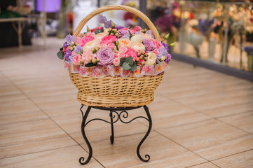 Fototapeta na wymiar beautiful bouquet of pink , purple flowers in basket