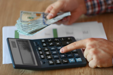 Man working on financial report at the office, close-up