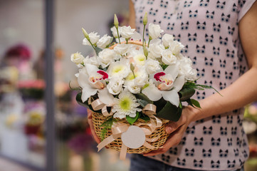 big white bouquet with huge orchids in hands