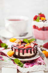 Delicious mini cheesecake decorated with berries and chocolate