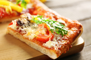 Pieces of delicious pizza on the table, close-up